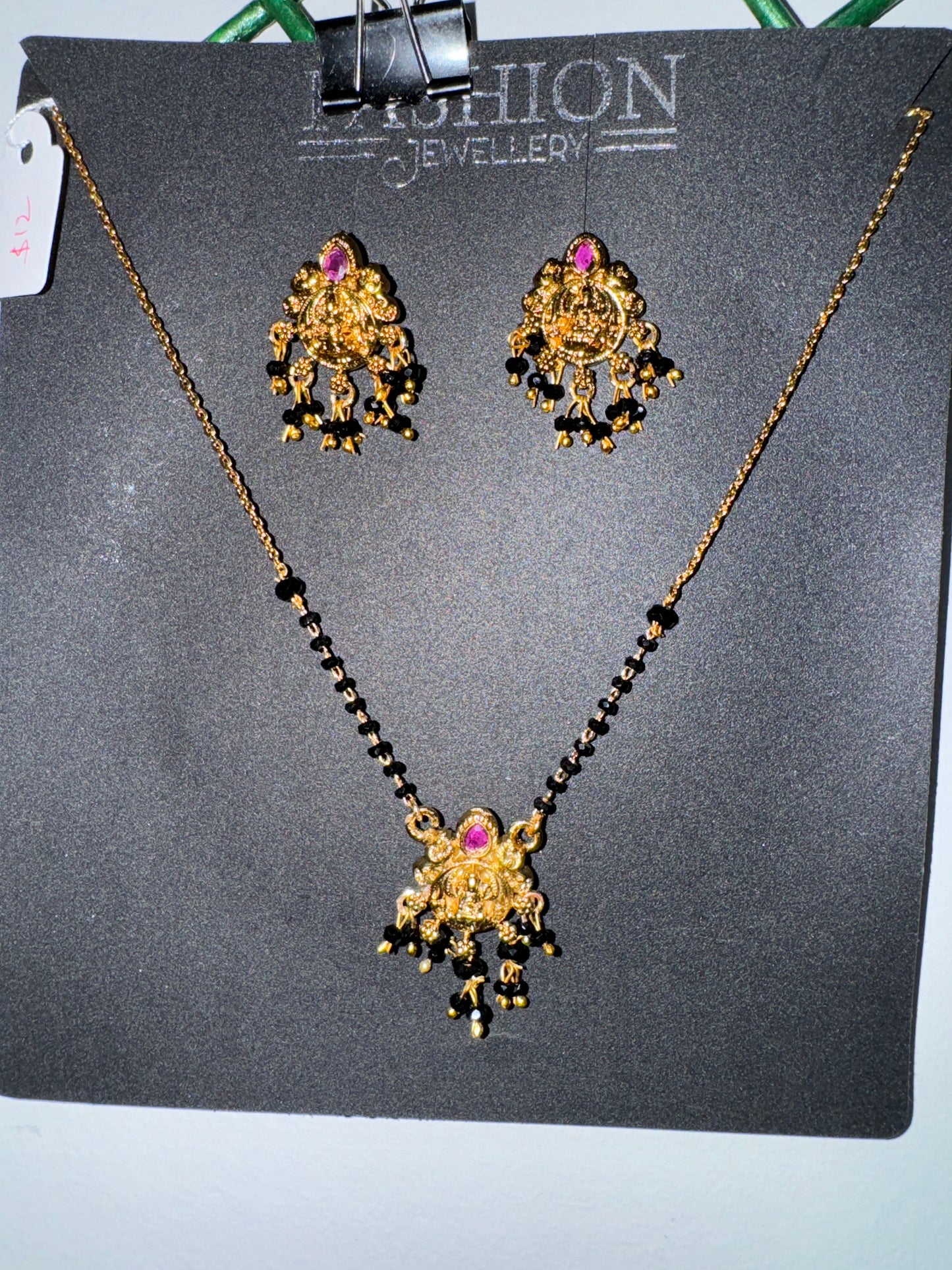 Beautiful Black Beads With Laxmi Devi Pendent And Earrings